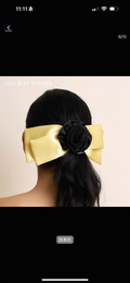 Statement yellow hair bow with black rosette